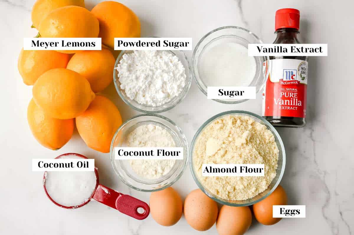 labeled ingredients for making meyer lemon bars on a white background.