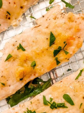 close up of air fryer garlic parmesan chicken tenders.