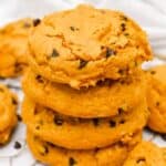 close up shot of a stack of cake mix pumpkin cookies.