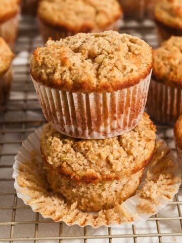 featured photo showing close up of a stack of gluten-free almond flour zucchini muffins.