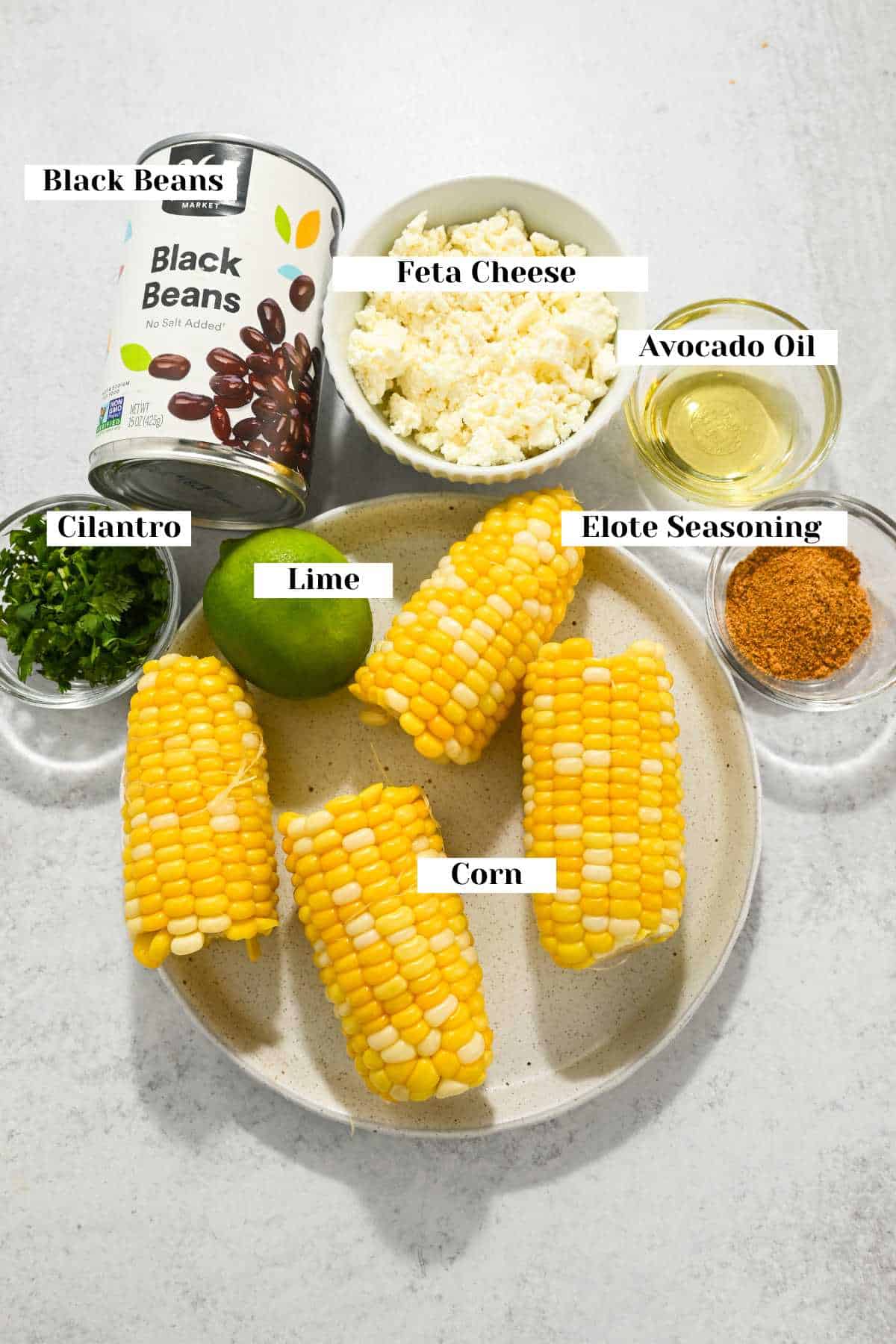 labeled ingredients for making corn, black bean, and feta dip.