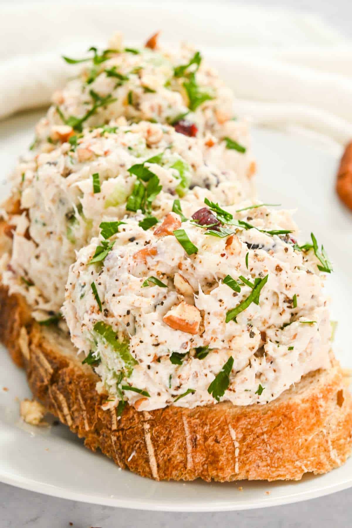 three scoops of cranberry chicken salad on top of toast.