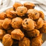 close up shot of pumpkin mini muffins in a pile.