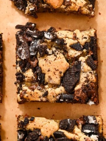close up of oreo brookies on brown parchment paper.