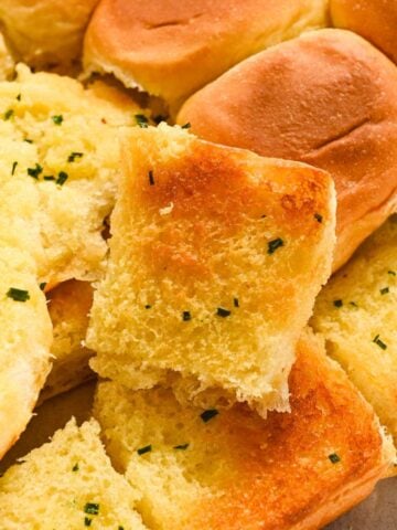 close up of Hawaiian roll garlic bread.