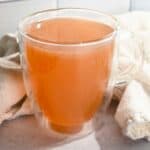 close up of Starbucks honey citrus mint tea recipe in a glass cup.