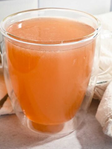 close up of Starbucks honey citrus mint tea recipe in a glass cup.