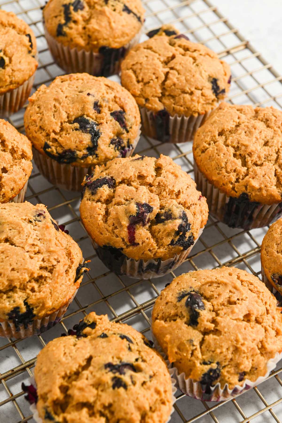 Kodiak Cakes blueberry muffin on a cooling rack.