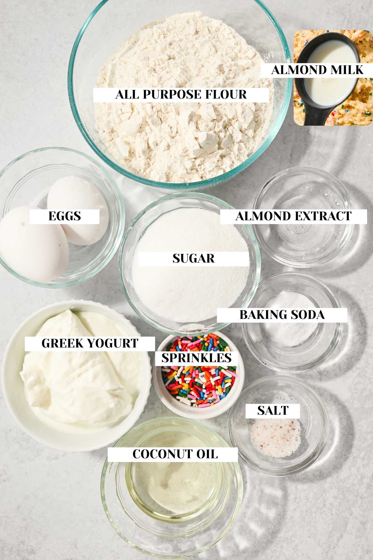 labeled ingredients for making a copycat recipe for little bites party cake muffins.