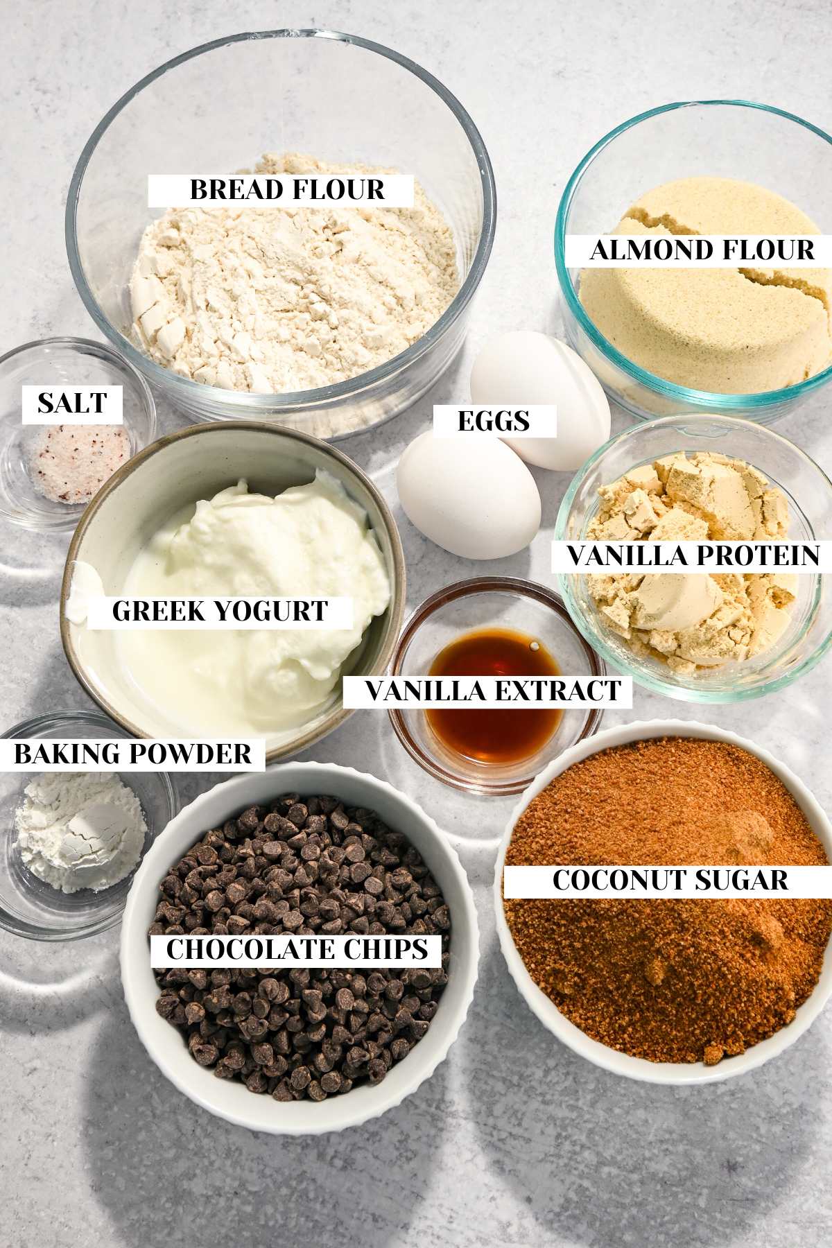 labeled ingredients for making chocolate chip protein muffins.