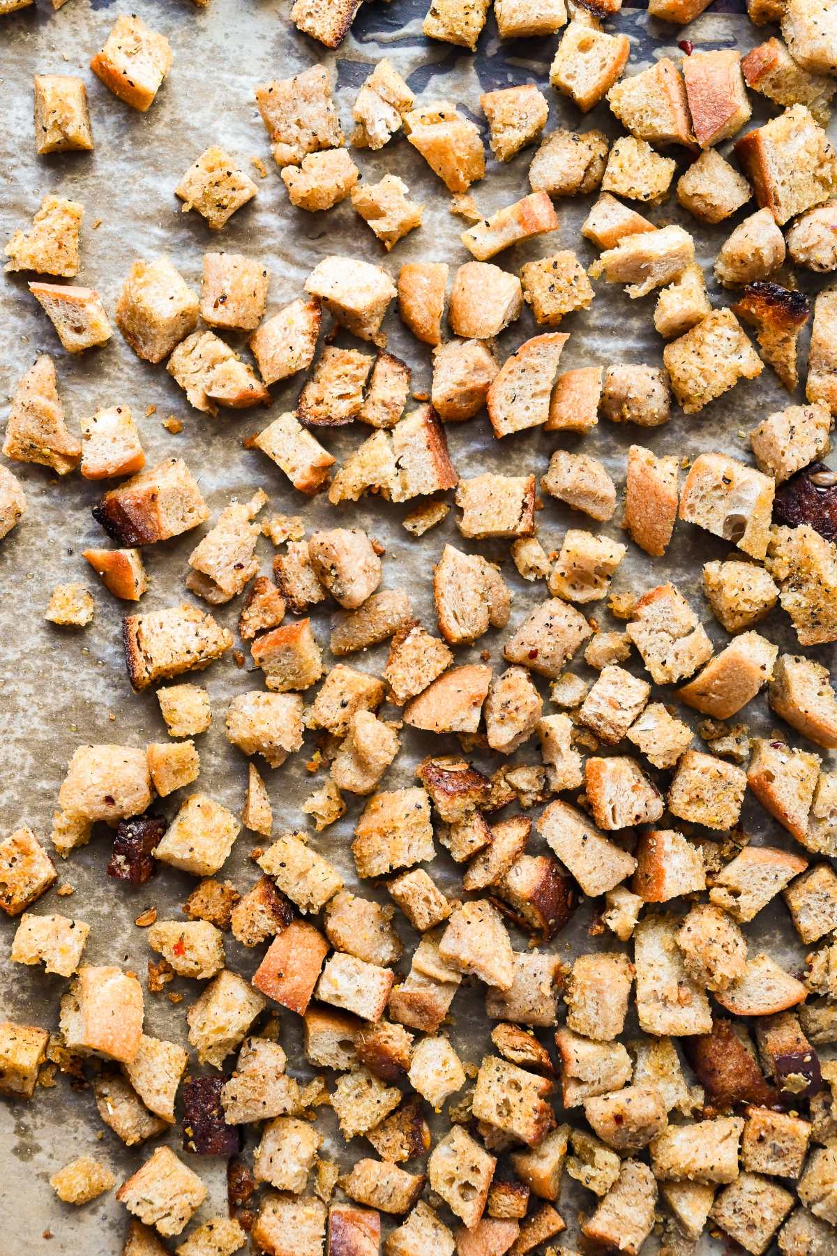 homemade sourdough croutons on a sheet pan.