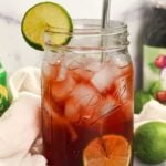 close up shot of tart cherry juice mocktail with lime.