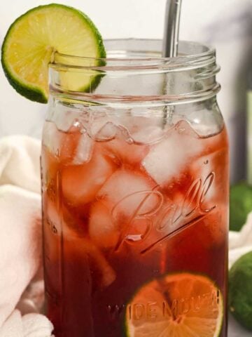 close up shot of tart cherry juice mocktail with lime.