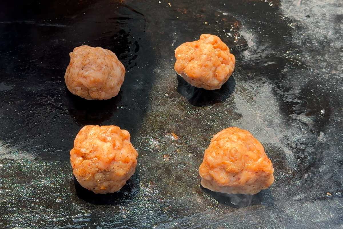 turkey smash burger meatballs on a Blackstone griddle.