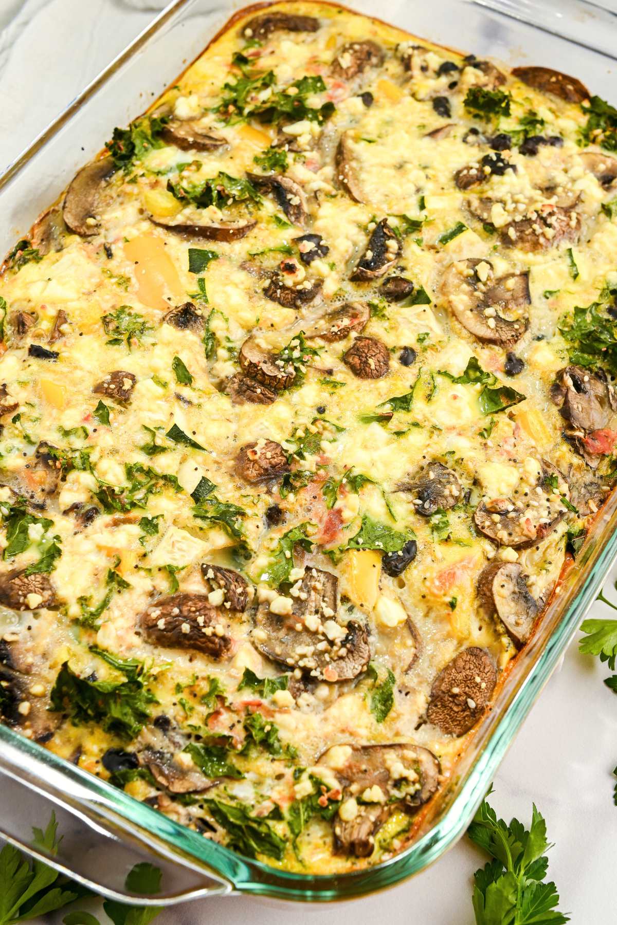 full view of veggie egg breakfast casserole in a glass dish.