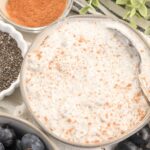 close up of cottage cheese chia pudding topped with cinnamon.