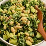 close up shot of green power salad with green goddess dressing.