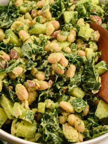 close up shot of green power salad with green goddess dressing.