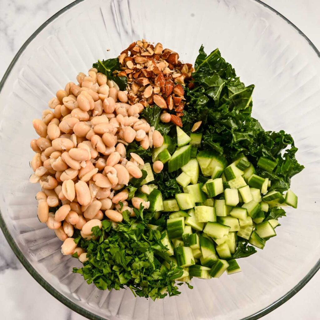 green power salad ingredients in a glass bowl.
