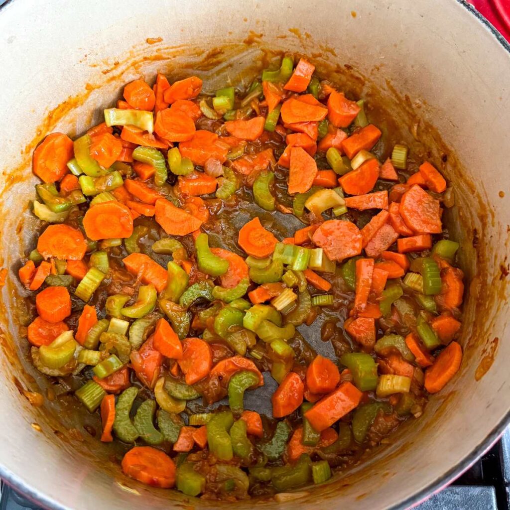 carrots, celery, and onions in a soup pot.